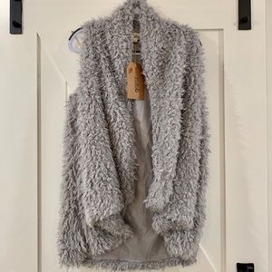 Listicle hi low pile vest